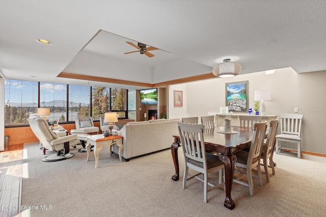 3574 E Tobler Rd # C16, Hayden, ID 83835 - dining room with light carpet, ceiling fan, and a tray ceiling