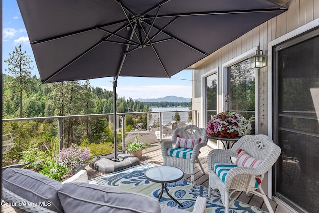 3574 E Tobler Rd # C16, Hayden, ID 83835 - balcony with outdoor lounge area and a water and mountain view