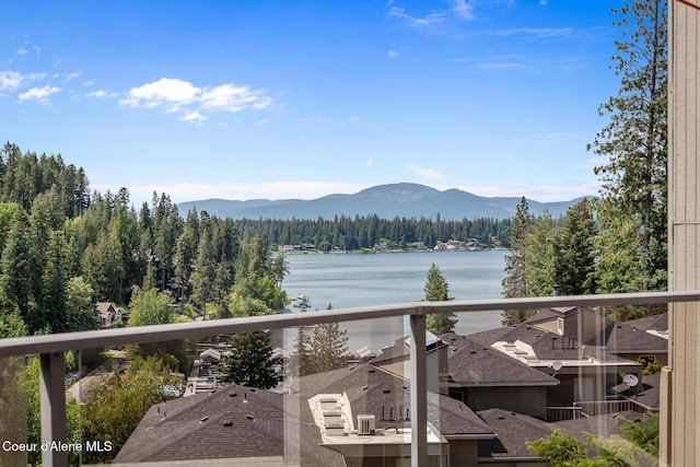3574 E Tobler Rd # C16, Hayden, ID 83835 - view of mountain backdrop with a forest and a nearby body of water