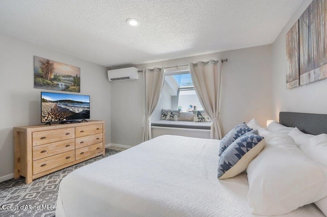 112 Holiday Loop Unit 838, Blanchard, ID 83804 - bedroom featuring a wall unit AC, a textured ceiling, and baseboards