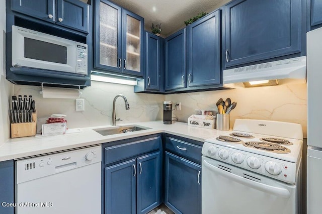 112 Holiday Loop Unit 838, Blanchard, ID 83804 - kitchen featuring white appliances, under cabinet range hood, and blue cabinets