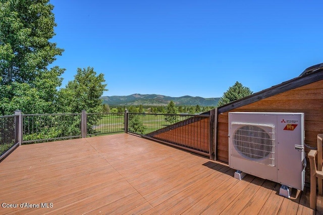 112 Holiday Loop Unit 838, Blanchard, ID 83804 - wooden deck featuring a cooling unit and a mountain view