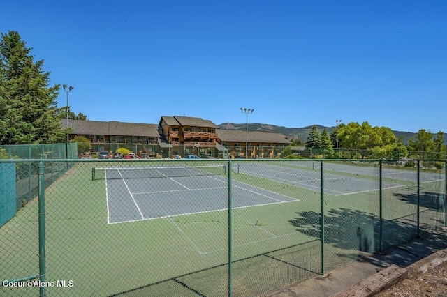 112 Holiday Loop Unit 838, Blanchard, ID 83804 - view of tennis court with a mountain view