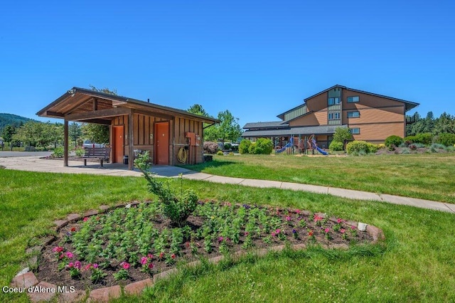 112 Holiday Loop Unit 838, Blanchard, ID 83804 - view of community with a playground, a yard, and a patio