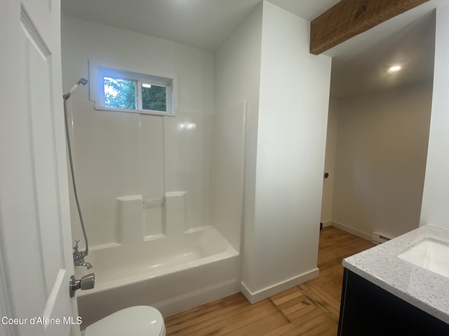 118 Faye St, Mullan, ID 83846 - bathroom with vanity, wood finished floors,  shower combination, and a baseboard radiator
