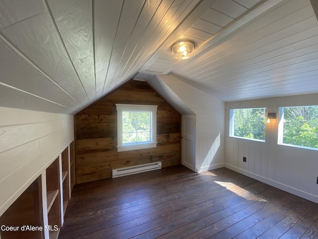 118 Faye St, Mullan, ID 83846 - additional living space featuring a baseboard radiator, dark wood-style floors, wooden walls, and vaulted ceiling
