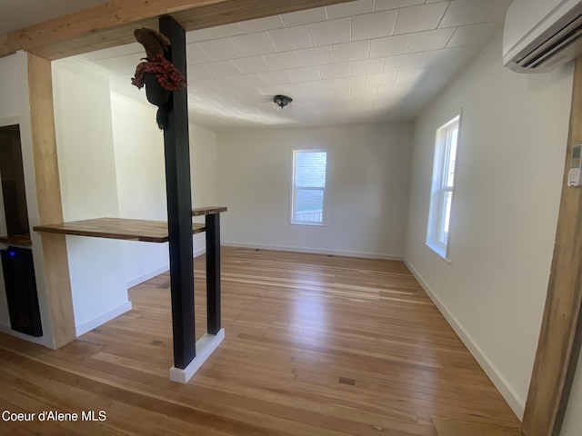 118 Faye St, Mullan, ID 83846 - spare room with a wall unit AC and light wood finished floors