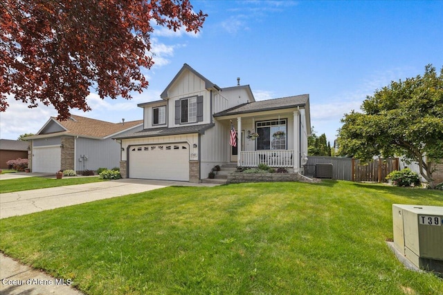 1748 W Durham Dr, Coeur Dalene, ID 83815 - view of front facade with covered porch, concrete driveway, central AC unit, board and batten siding, and a garage