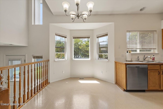 1748 W Durham Dr, Coeur Dalene, ID 83815 - kitchen with dishwasher, a sink, a chandelier, brown cabinetry, and light floors