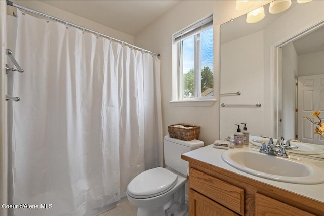 1748 W Durham Dr, Coeur Dalene, ID 83815 - full bathroom with toilet, vanity, and curtained shower