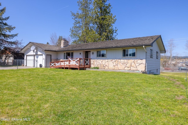 1364 C St, Plummer, ID 83851 - ranch-style home with a chimney, an attached garage, concrete driveway, and a wooden deck