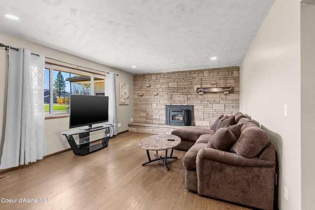 1364 C St, Plummer, ID 83851 - living room featuring wood finished floors, a textured ceiling, recessed lighting, and baseboards