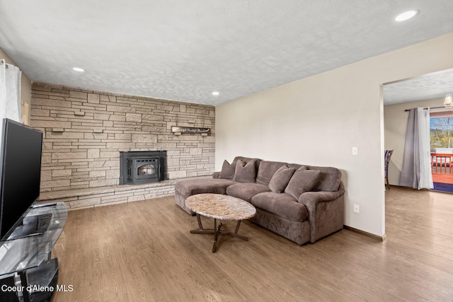 1364 C St, Plummer, ID 83851 - living room featuring wood finished floors, a textured ceiling, and recessed lighting