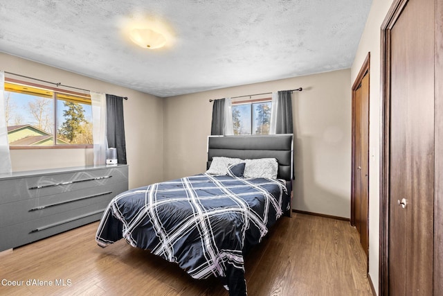 1364 C St, Plummer, ID 83851 - bedroom featuring wood finished floors, baseboards, and a closet