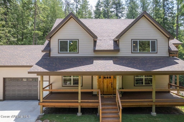 122 Cottonwood Dr, Sagle, ID 83860 - view of front of home with an attached garage, a shingled roof, and concrete driveway
