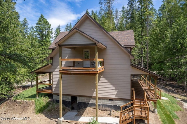 122 Cottonwood Dr, Sagle, ID 83860 - back of house featuring stairs, roof with shingles, and crawl space