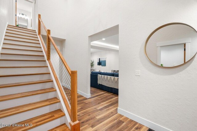 122 Cottonwood Dr, Sagle, ID 83860 - staircase featuring wood finished floors and a textured wall