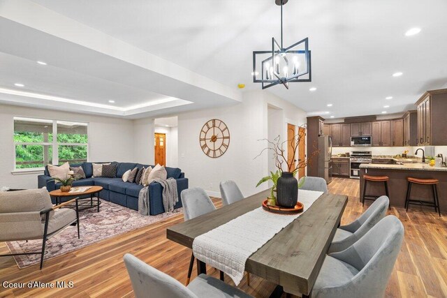 122 Cottonwood Dr, Sagle, ID 83860 - dining room with light wood finished floors, a chandelier, and recessed lighting