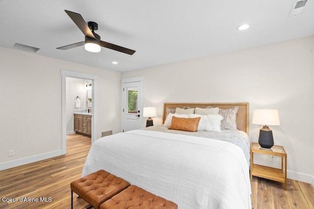 122 Cottonwood Dr, Sagle, ID 83860 - bedroom featuring wood finished floors, recessed lighting, ensuite bathroom, and a ceiling fan