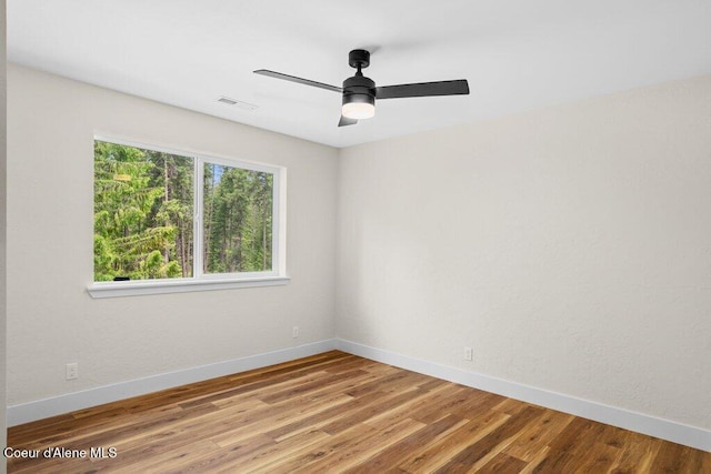 122 Cottonwood Dr, Sagle, ID 83860 - unfurnished room with wood finished floors and ceiling fan