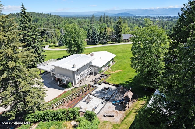 10851 W Pine St, Sandpoint, ID 83864 - aerial view of property and surrounding area with a forest and a mountain backdrop