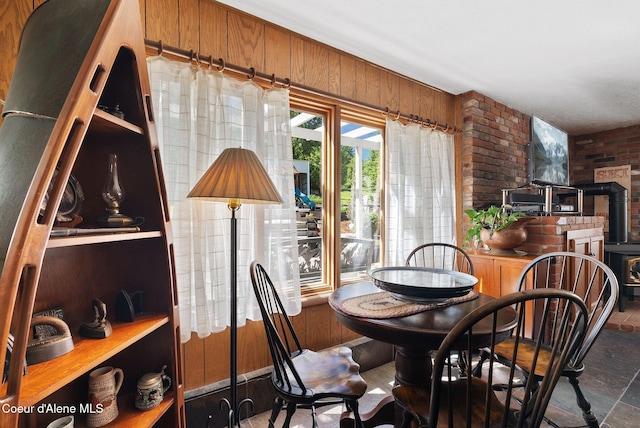 10851 W Pine St, Sandpoint, ID 83864 - dining space featuring brick wall and wood walls