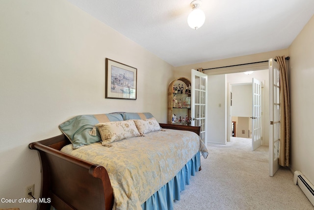 10851 W Pine St, Sandpoint, ID 83864 - carpeted bedroom featuring a baseboard heating unit