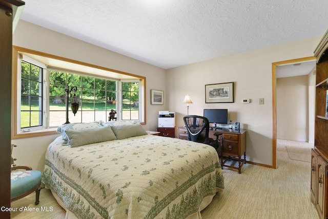 10851 W Pine St, Sandpoint, ID 83864 - bedroom featuring light colored carpet and a textured ceiling