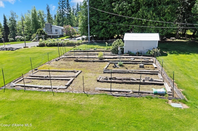 10851 W Pine St, Sandpoint, ID 83864 - view of green lawn with a garden