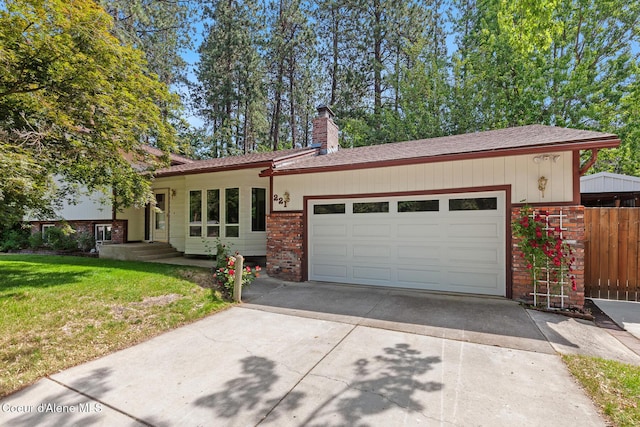 221 S Ridgewood Dr, Post Falls, ID 83854 - view of front of property featuring brick siding, concrete driveway, a garage, a chimney, and a shingled roof