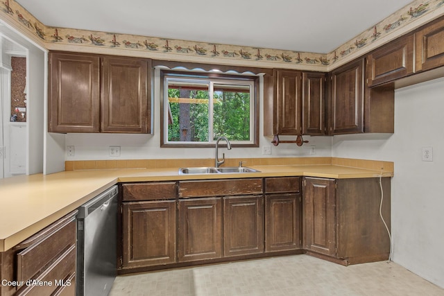 221 S Ridgewood Dr, Post Falls, ID 83854 - kitchen featuring dishwasher, light countertops, and dark brown cabinets
