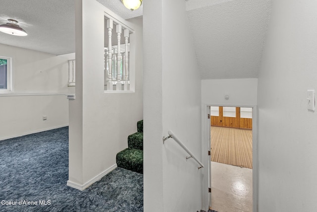 221 S Ridgewood Dr, Post Falls, ID 83854 - staircase featuring a textured ceiling and carpet