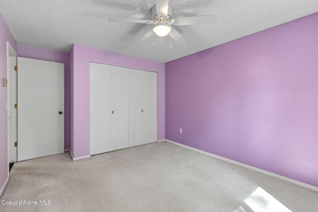 221 S Ridgewood Dr, Post Falls, ID 83854 - unfurnished bedroom with carpet, a textured ceiling, a closet, and a ceiling fan