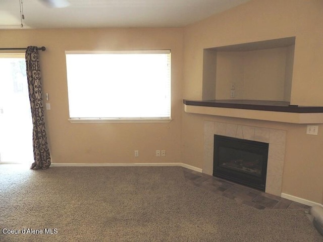 3696 N Steven Pl, Coeur Dalene, ID 83815 - unfurnished living room with plenty of natural light, carpet floors, a fireplace, and baseboards