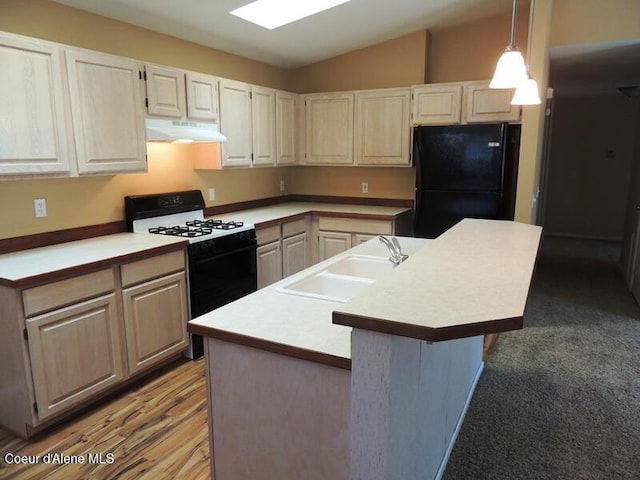 3696 N Steven Pl, Coeur Dalene, ID 83815 - kitchen featuring freestanding refrigerator, range with gas cooktop, a sink, under cabinet range hood, and light countertops