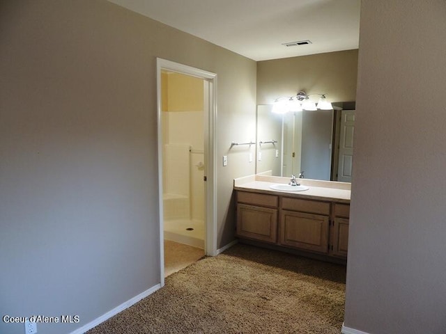 3696 N Steven Pl, Coeur Dalene, ID 83815 - bathroom featuring vanity, a shower stall, and baseboards