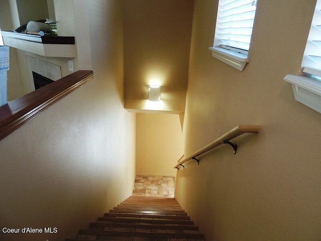 3696 N Steven Pl, Coeur Dalene, ID 83815 - staircase featuring a fireplace