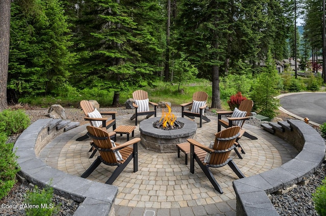 6767 S Renaissance Way, Coeur Dalene, ID 83814 - view of patio / terrace with a fire pit