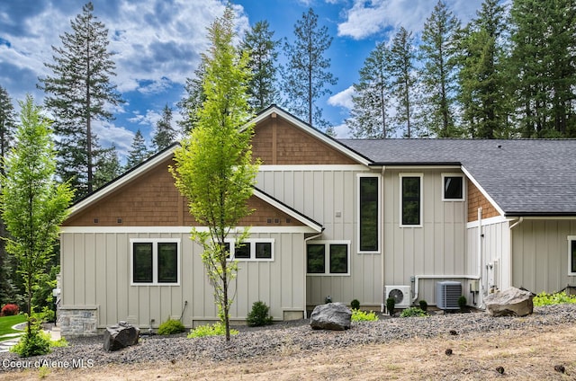6767 S Renaissance Way, Coeur Dalene, ID 83814 - back of house with roof with shingles and board and batten siding