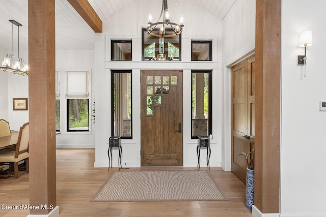 6767 S Renaissance Way, Coeur Dalene, ID 83814 - entryway featuring a chandelier, light wood-style flooring, and wooden ceiling