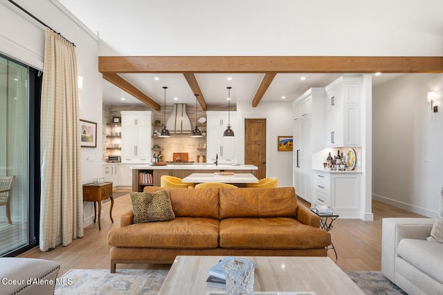 6767 S Renaissance Way, Coeur Dalene, ID 83814 - living room featuring beam ceiling, light wood-style floors, and recessed lighting
