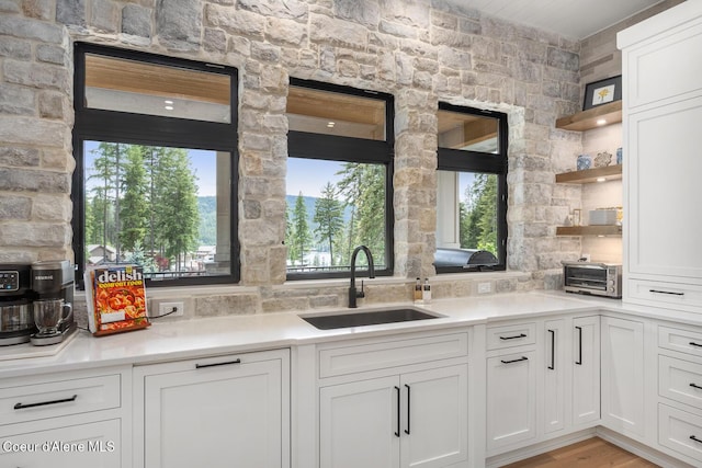 6767 S Renaissance Way, Coeur Dalene, ID 83814 - kitchen featuring open shelves, white cabinets, and light countertops