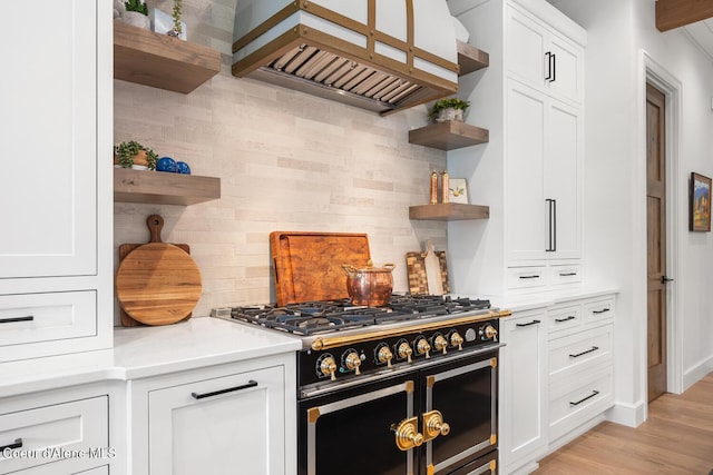 6767 S Renaissance Way, Coeur Dalene, ID 83814 - kitchen with open shelves, range with two ovens, custom range hood, and tasteful backsplash