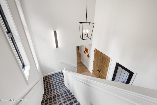 6767 S Renaissance Way, Coeur Dalene, ID 83814 - staircase featuring a chandelier