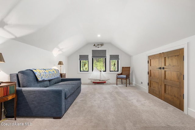 6767 S Renaissance Way, Coeur Dalene, ID 83814 - carpeted living area with lofted ceiling and baseboards