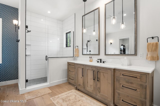 6767 S Renaissance Way, Coeur Dalene, ID 83814 - bathroom featuring wood finished floors, a stall shower, and vanity