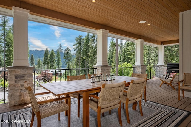 6767 S Renaissance Way, Coeur Dalene, ID 83814 - wooden terrace with area for grilling and outdoor dining area