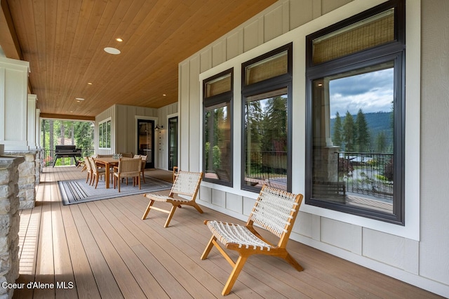 6767 S Renaissance Way, Coeur Dalene, ID 83814 - wooden porch featuring outdoor dining space