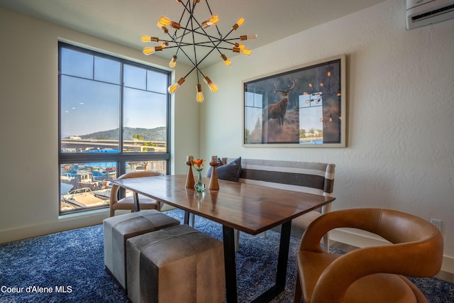 115 E Lake St Unit 203, Sandpoint, ID 83864 - dining area with a chandelier, a wall mounted AC, a textured wall, carpet floors, and a mountain view