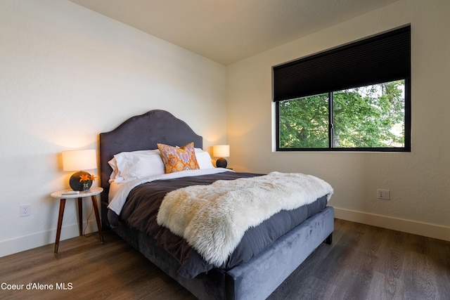115 E Lake St Unit 203, Sandpoint, ID 83864 - bedroom with wood finished floors and baseboards